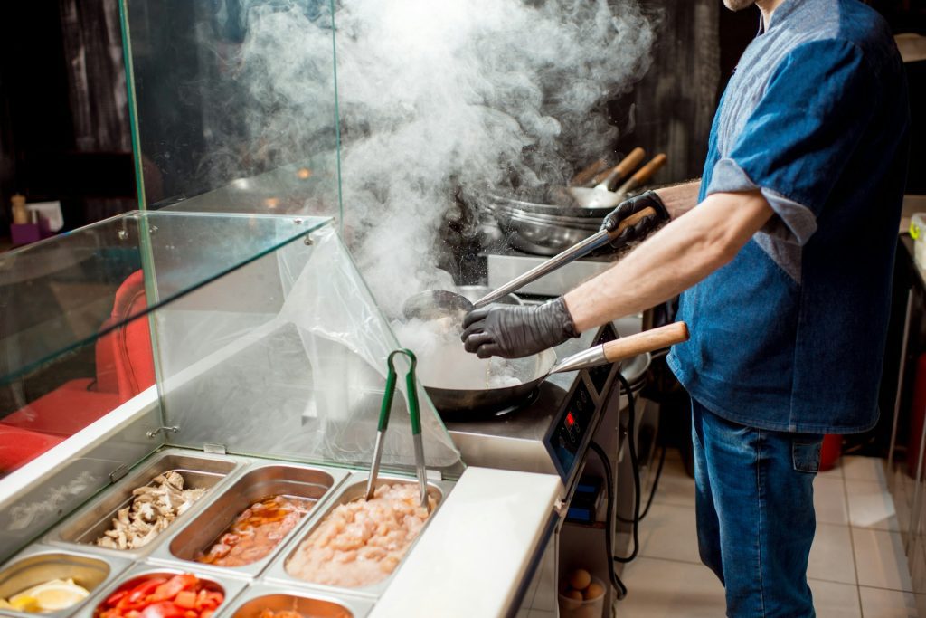 Steam rising from cooking in a commercial kitchen